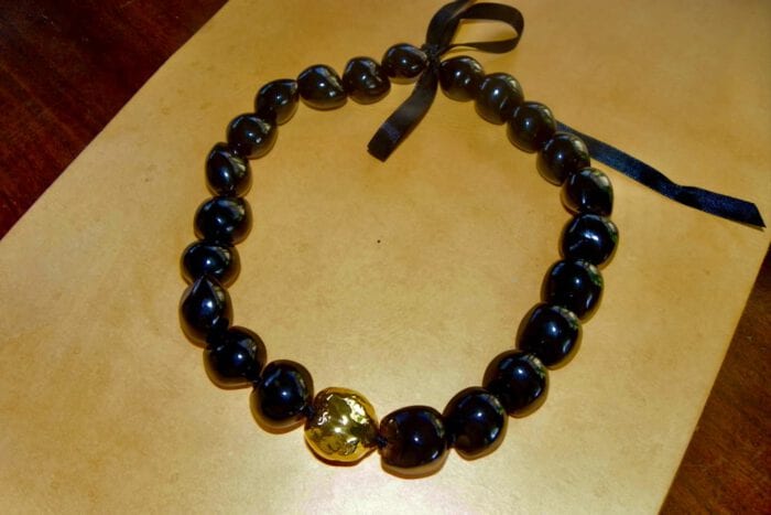 21 inch Black Polished Kukui Nut Lei with 24K Gold Plated Tiger Kukui Nut Middle