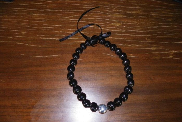 25 inch Black Kukui Nut Lei with 99% Pure Silver Plated Center Kukui