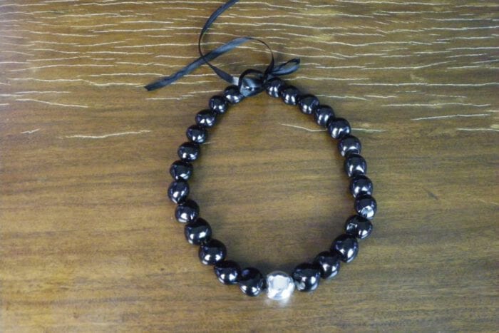 25 inch Black Kukui Nut Lei with 99% Pure Silver Plated Center Kukui