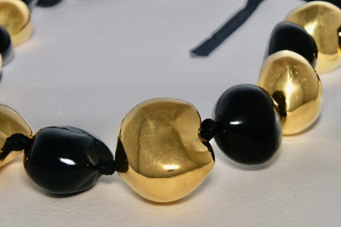 33 inches long Black Polished Kukui Nut Lei with Seven 24K Gold Plated Kukui Nuts