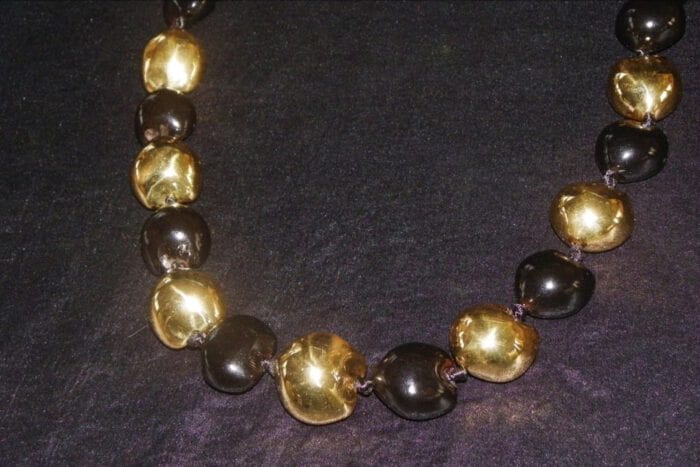 33 inches long Black Polished Kukui Nut Lei with Seven 24K Gold Plated Kukui Nuts