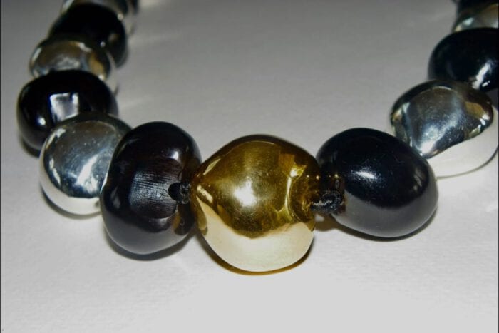 35 inches long Polished Black Kui Nut Lei with 24K Gold Center Kukui surrounded with Ten 99% Pure Fine Silver Kukui Nuts