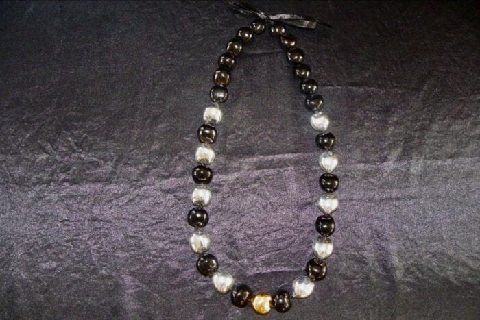 35 inches long Polished Black Kui Nut Lei with 24K Gold Center Kukui surrounded with Ten 99% Pure Fine Silver Kukui Nuts