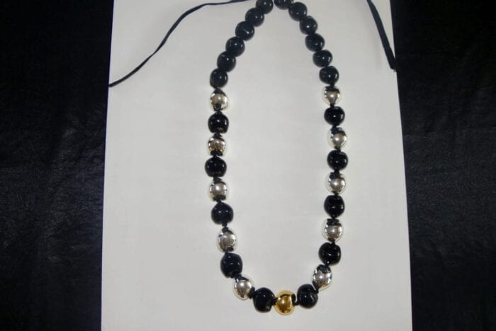 35 inches long Polished Black Kui Nut Lei with 24K Gold Center Kukui surrounded with Ten 99% Pure Fine Silver Kukui Nuts