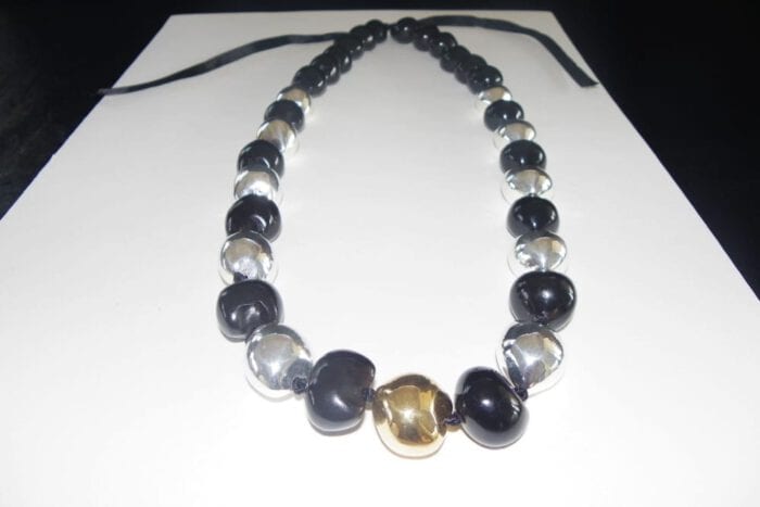 35 inches long Polished Black Kui Nut Lei with 24K Gold Center Kukui surrounded with Ten 99% Pure Fine Silver Kukui Nuts