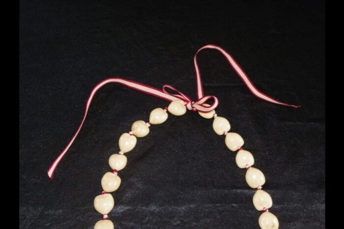 36 inches Long Natural Kukui Nut Lei with a single 18K Rose Gold Center Kukui Nut