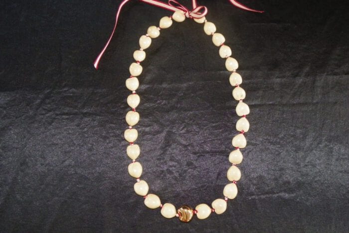 36 inches Long Natural Kukui Nut Lei with a single 18K Rose Gold Center Kukui Nut