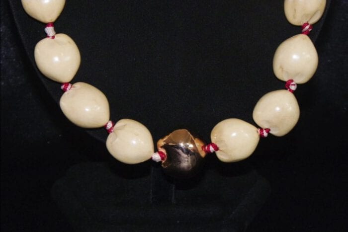 36 inches Long Natural Kukui Nut Lei with a single 18K Rose Gold Center Kukui Nut