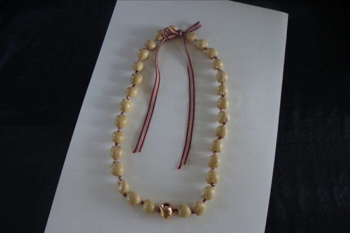 36 inches Long Natural Kukui Nut Lei with a single 18K Rose Gold Center Kukui Nut