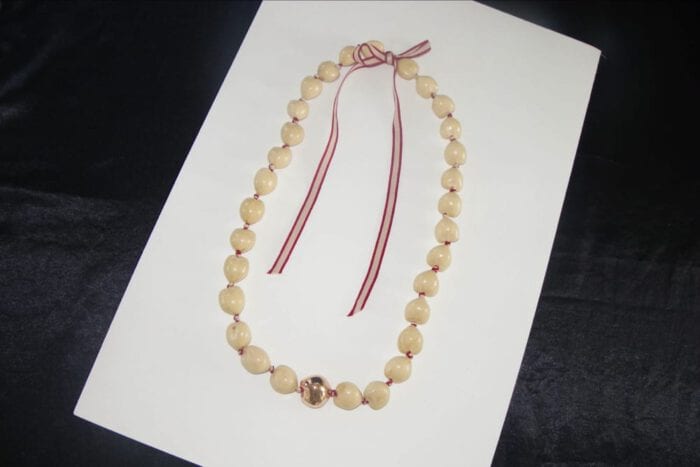 36 inches Long Natural Kukui Nut Lei with a single 18K Rose Gold Center Kukui Nut