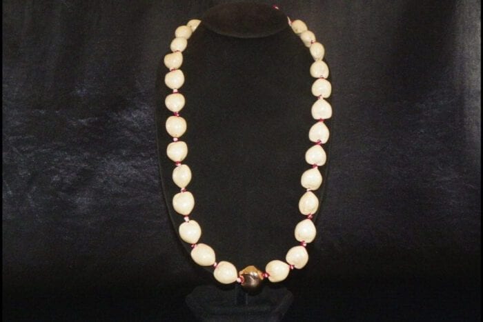 36 inches Long Natural Kukui Nut Lei with a single 18K Rose Gold Center Kukui Nut