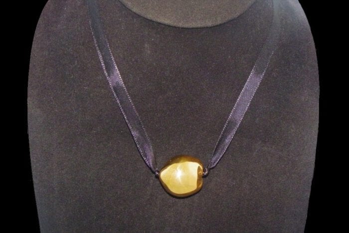 Single 24K Gold Plated Kukui Nut on a Black Satin Ribbon