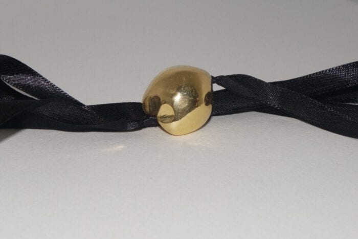 Single 24K Gold Plated Kukui Nut on a Black Satin Ribbon