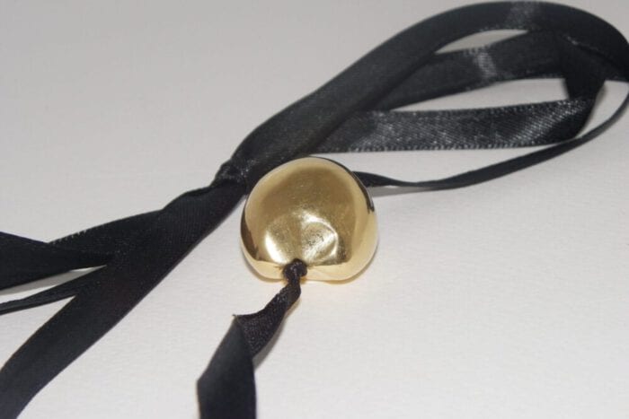 Single 24K Gold Plated Kukui Nut on a Black Satin Ribbon