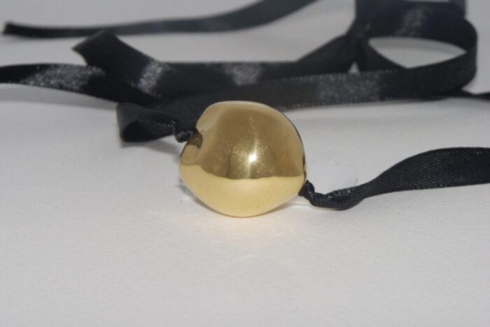 Single 24K Gold Plated Kukui Nut on a Black Satin Ribbon